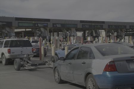 Multiple vehicles wait in line to cross the border at the El Paso port of entry in El Paso, Texas. (National Geographic)