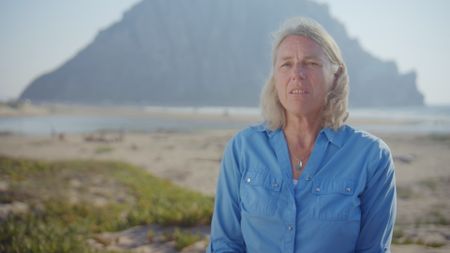 Elinor Dempsey, contributor, being interviewed as she recalls her encounter with a shark that bit her board while she was surfing in Morro Bay, CA. (National Geographic)