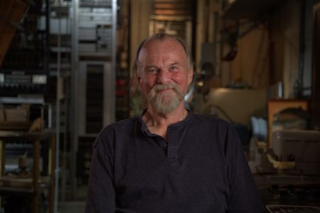 Sonar Operator John Lettow is pictured in a portrait made during the production of "Cursed Gold: A Shipwreck Scandal." In 1989, maverick scientist Tommy Thompson stuns the world by recovering three tons of gold from a shipwreck deep in the Atlantic Ocean. What follows is a 30-year story of adventure, deception, and personal turmoil, taking him from venerated celebrity to infamous fugitive, and finally a defiant prisoner who refuses to give up his gold. (National Geographic)