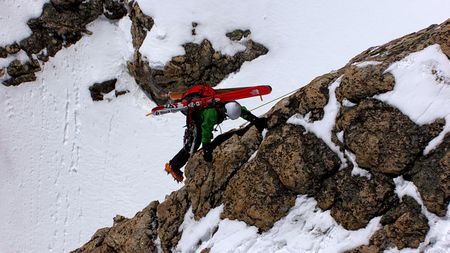 Jimmy Chin climbs a mountain with skis on his back.  (credit: Jimmy Chin Productions)