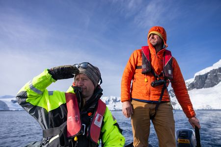 Cameraman Spencer Millsap and skipper Radoslaw 'Radek' Kloskowski on a rib.  (credit: National Geographic/Bertie Gregory)