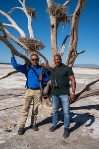Christian Cooper and Frank Ruiz stand in front of a dead tree with nests that used to be homes to Great Blue Herons. The Salton Sea has long been a vital stop for migrating birds. (National Geographic/Jon Kroll)