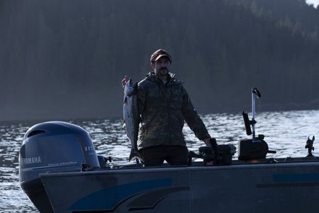 Cole Sturgis successfully catches a winter king salmon for his dinner. (BBC Studios Reality Productions, LLC/Lukas Taylor)