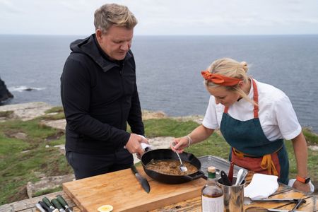 Gordon Ramsay gives Chef Anna Haugh a taste of his dish during the final cook. (National Geographic/Justin Mandel)