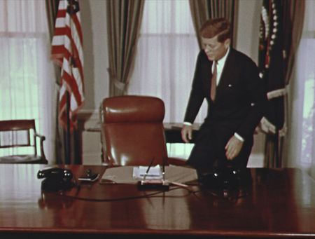 President John F. Kennedy takes his seat in the Oval Office at the White House in Jan. 1961, in Washington, D.C. (John F. Kennedy Presidential Library and Museum, Boston)