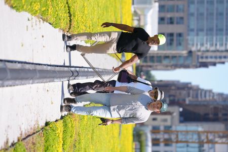 Christian Cooper, field biologist Emilio Tobón, and NYC Audubon director of conservation and science Dr. Dustin Partridge walk across the Javits Center green roof, preparing to catch and band herring gulls. (National Geographic/Troy Christopher)