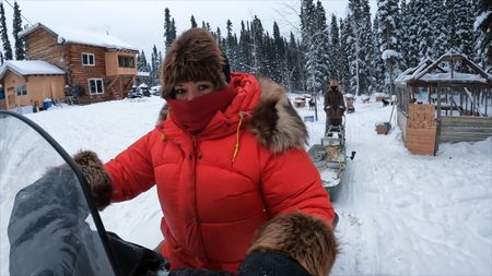 Jody Potts-Joseph sets out on her snowmobile to set marten traps with her husband, Jamey Joseph. (National Geographic)