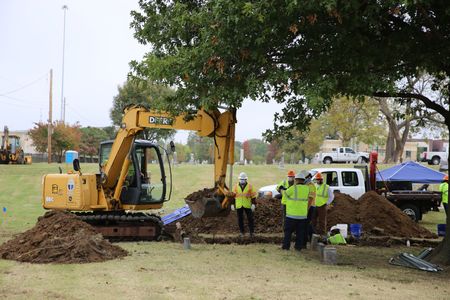 A team of archaeologists excavates Oaklawn Cemetery in Tulsa, OK, searching for unmarked graves. In October 2020, the team uncovered unmarked mass graves in the cemetery, thought to belong to the victims of the 1921 race massacre. (National Geographic/Lisa Hendin)