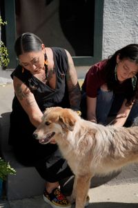 Victoria and Araceli petting Maverick. (National Geographic)