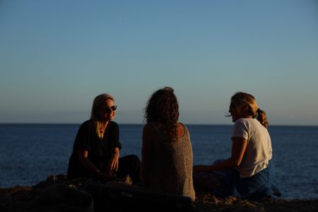 Mariana van Zeller sits with her best friend and cousin on the coast of Portugal. (National Geographic for Disney)