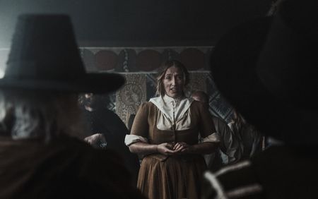 An accused woman stands before the court with Hopkins and Stearne in attendance. (Dash Productions Services LTD/Antoan Ivanov)