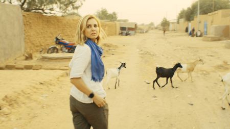 Mariana van Zeller walks the streets of Agadez. (National Geographic for Disney)
