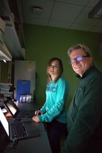 Dr. Megan Winton and Dr. Greg Skomal, look at the data retrieved from Liberty's tag in a lab at the School for Marine Science and Technology in New Bedford, MA. (National Geographic/Zara Tyne)