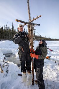 Andy Bassich and Denise Becker set beaver traps in the winter season when their fur is prime. (BBC Studios Reality Production/Ben Mullin)