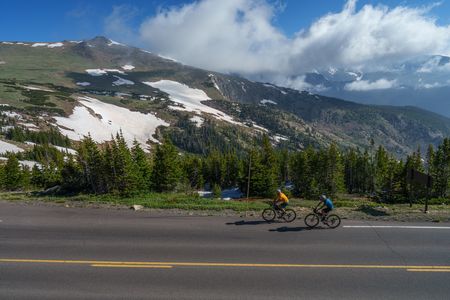 On June 29, 2023 Tommy Caldwell and Alex Honnold ride through Rocky Mountain National Park, outside of Estes Park, Co to begin an expedition that includes biking, hiking, sailing and climbing. They rode just shy of 2,300 and the expedition took 55 days.  (National Geographic/Taylor Shaffer)