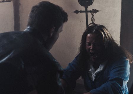 Barbara Napier screaming in pain, she is held down and tortured for confession. (Dash Productions Services LTD/Antoan Ivanov)