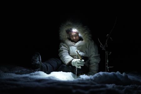 Agnes Hailstone ice fishes with her family on the frozen river late at night. (BBC Studios Reality Productions, LLC/Dwayne Fowler)