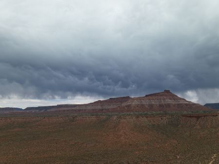 Dark storm clouds form over one of Zion's many mesas during monsoon season. (National Geographic/Jeff Reed)