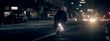 Manila, Philippines - Two people riding in tandem on a motorbike through the streets of Manila. (Genius Loki Film and Violet Films/Alexander A. Mora)