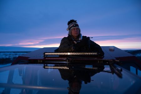 Sue Aikens travels in her all terrain vehicle, on the hunt for ptarmigan and rabbits. (BBC Studios Reality Productions, LLC/Jayce Kolinski)