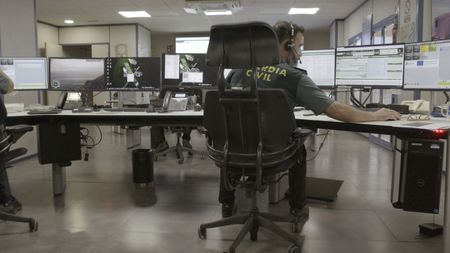 A guard works at the surveillance center in Almería, Spain. (National Geographic)