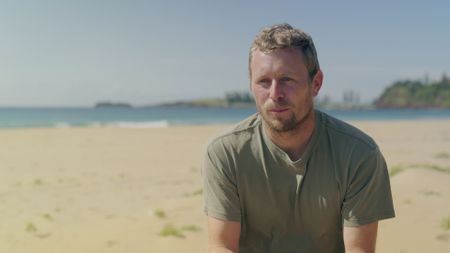 Joel Trist, contributor, being interviewed on Bombo Beach, Australia as he recalls how he witnessed his friend, Brett Connellan being attacked by a shark as they were out surfing together. (National Geographic)