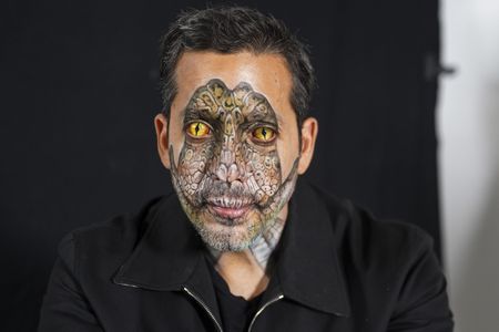 David Blaine poses with his reptile-painted face and contact lenses.   (credit: National Geographic/Dana Hayes)