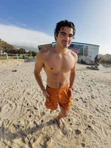 Caleb Swanepoel on Camps Bay Beach, Cape Town. (National Geographic/Robert Cowling)