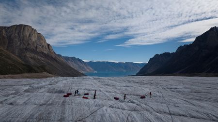 Alex Honnold and his expedition team traverse a section of dry glacier in Eastern Greenland.  (photo credit: National Geographic/Pablo Durana)