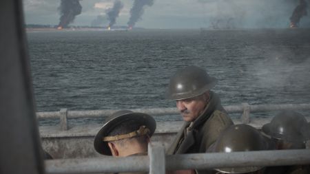 Major Akbar Khan (played by Jack Gill) stands next to soldiers on board a ship after their evacuation from the northern coast of France after Dunkirk in a WW2 historic reenactment scene for "Erased: WW2's Heroes of Color." Major Akbar Khan was the most senior Indian in the British Army during WW2 and a member of Force K6, a little-known Indian regiment of mule handlers. Amidst the chaos of Dunkirk and the advancing German Army, the Indian regiment fought for victory and independence. (National Geographic)