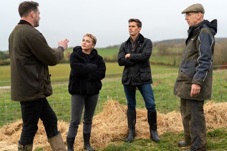 Tommy Banks, Florence Pugh, Antoni Porowski and Tommy Banks Sr. on the Banks family farm in Yorkshire. (National Geographic/Chris Raphael)