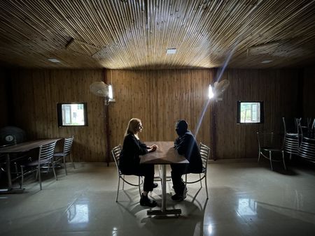Mariana van Zeller interviews "Beta," a man involved in the production of fake pills, at an undisclosed location in Northern India. (National Geographic for Disney)