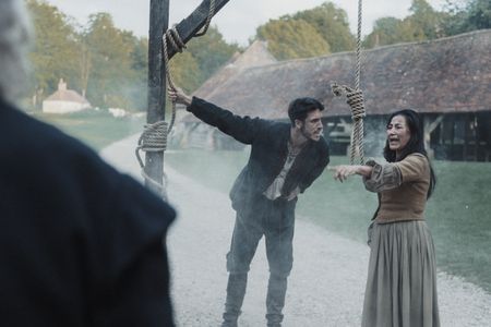 Sarah Osborne stands at the gallows and points at the crowd around her. (Dash Productions Services LTD/Antoan Ivanov)