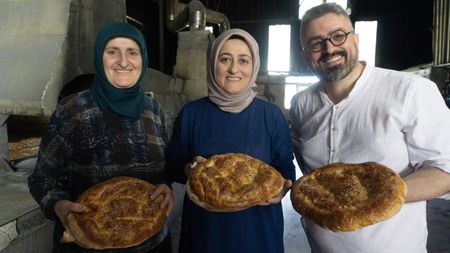 Baker Hakan Do?an stands with Iznik bakers who proudly display their Ramadan Pide loaves. Turkish bakers make this bread one month a year, to celebrate the Muslim holiday of Ramadan. (National Geographic/Madeline Turrini)