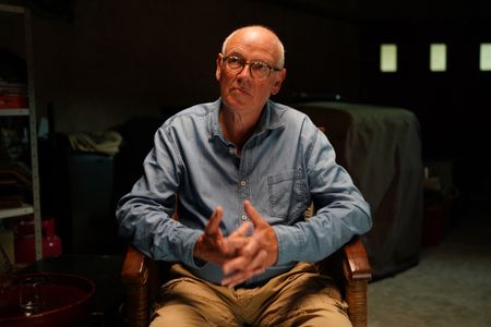 Stéphane Bourgoin is a French author and renowned specialist on serial killers, who since 2019 has been at the center of an internet-led controversy spearheaded by a group of anonymous true crime fans.  Here, Bourgoin poses for a portrait during the production of "Killer Lies: Chasing a True Crime Con Man," a documentary series about obsession and deception, following the unraveling of Stephane Bourgoin’s career as a best-selling author and serial killer expert. (National Geographic/Ben Selkow)