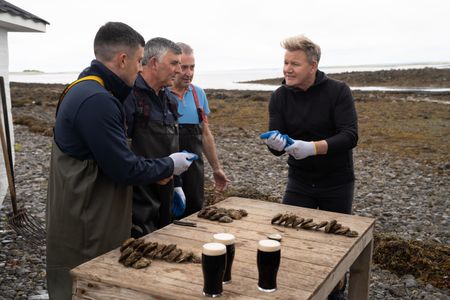 Michael Kelly Jr., Michael Kelly Sr., Diarmuid Kelly and Gordon Ramsay shuck oysters. (National Geographic/Justin Mandel)