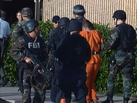 Timothy McVeigh arrives at Tinker Air Force Base under heavy guard on April 21, 1995. (National Geographic)