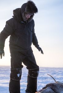 Ricko DeWilde hunts a caribou for himself and his community, while also tracking down a wolf. (BBC Studios Reality Production/Ashton Hurlburt)