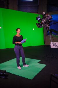 Diva Amon rehearsing in front of the green screen at the studio lab shoot. (National Geographic/Aubrey Fagon)