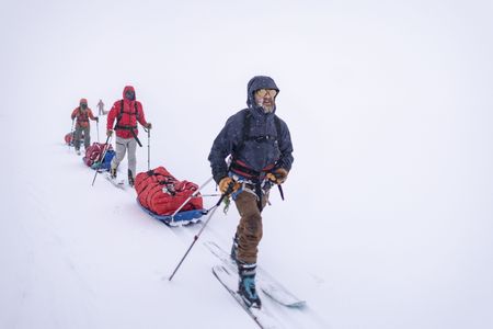 Alex Honnold's expedition team, led by Aldo Kane, traverse the Renland Icecap in Eastern Greenland.  (photo credit: National Geographic/Pablo Durana)