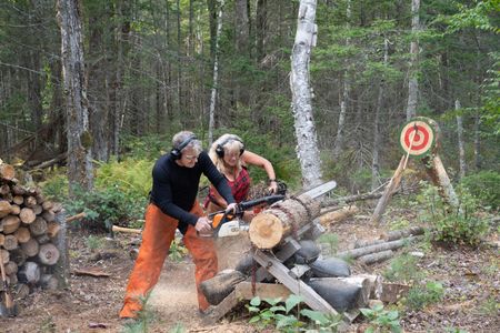 Maine - Gordon Ramsay (L) and Tina have a chainsaw race. (Credit: National Geographic/Justin Mandel)