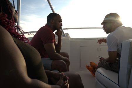 Anthony Mackie talks to director Matt Kay ahead of swimming with sharks at Deep Ledge (Atlantic Ocean). (National Geographic/Lisa Tanner)