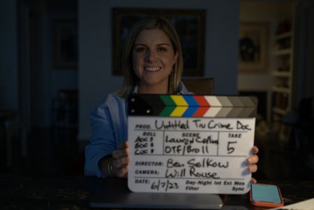 The New Yorker staff writer Lauren Collins Lauren Collins holds a clapboard used in the production of "Killer Lies: Chasing a True Crime Con Man," a documentary series about obsession and deception, following the unraveling of Stephane Bourgoin’s career as a best-selling author and serial killer expert. (National Geographic/Ben Selkow)