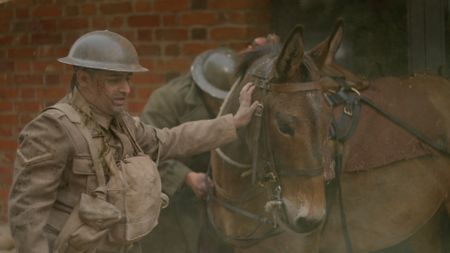 Injured Corporal Chaudry Wali Mohammad (played byAli Afzal) stands next to one of the regiment's mules in a WW2 historic reenactment scene for "Erased: WW2's Heroes of Color." Corporal Chaudry Wali Mohammed was a member of Force K6, an Indian Regiment of mule handlers in WW2. Amidst the chaos of Dunkirk and the advancing German Army, one little-known Indian Regiment fights for victory and independence. (National Geographic)