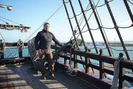 Claudio Lozano stands on the deck of a Puntales ship, standing by the mast. The ship was used to defend against the french navy in the penninsular war in Spain. (National Geographic/Ciaran Henry)