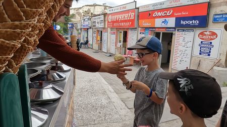 Colin Pelletier gets ice cream from a vendor in Turkey. (Credit: Edith Lemay)