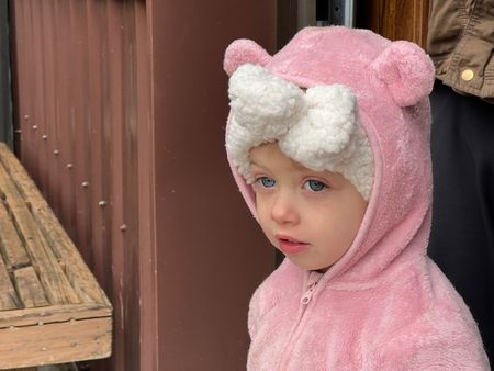 Abigail Pol in a pink teddy bear hoodie for the Pumpkin Patch Festival Of 2022 that the Reinhold family hosts. (National Geographic)