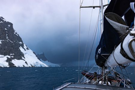 On board the Spirit of Sydney looking back at adverse weather conditions across the bay.  (credit: National Geographic/Bertie Gregory)