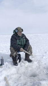 John Pingayak ice fishing. (National Geographic/Matt Kynoch)