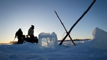 Gage and Avery Hoffman check their nets for fish. (BBC Studios/Danny Day)